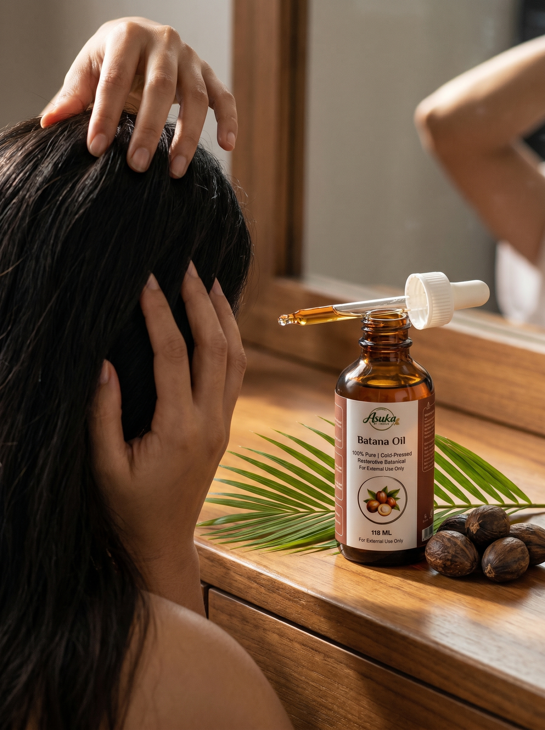 Massaging Asuka Batana Oil into the scalp